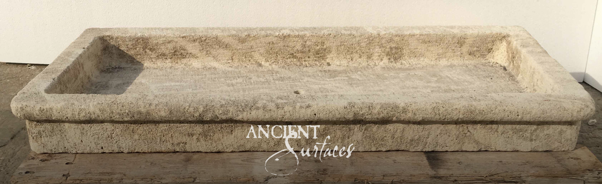 Long hand-carved antique limestone trough basin